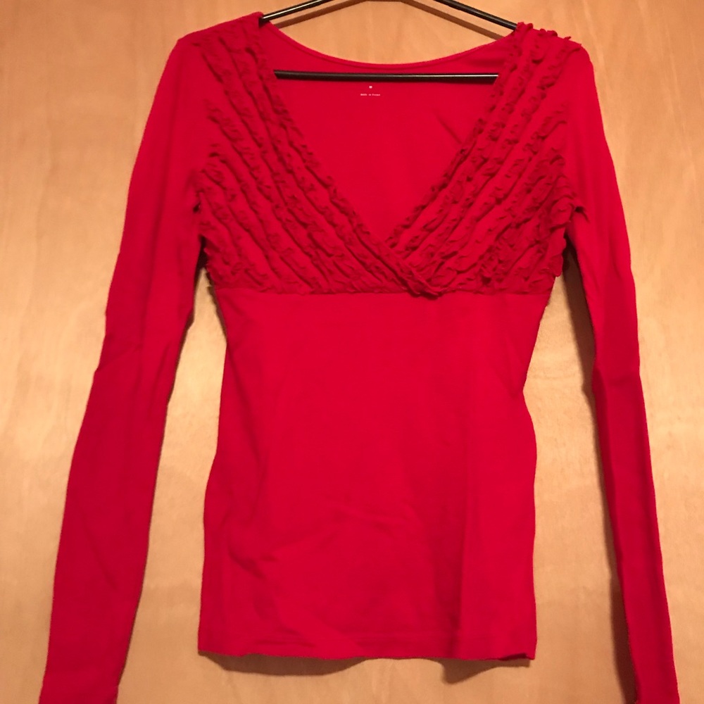 Red low cut top, ruffles.